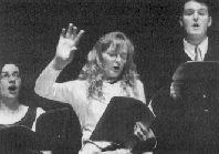 Christine McCarthy directing the Festival Choir of Carnivale Christi